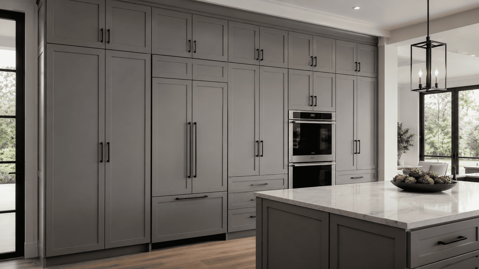 Floor-to-ceiling gray shaker pantry cabinets create seamless kitchen storage