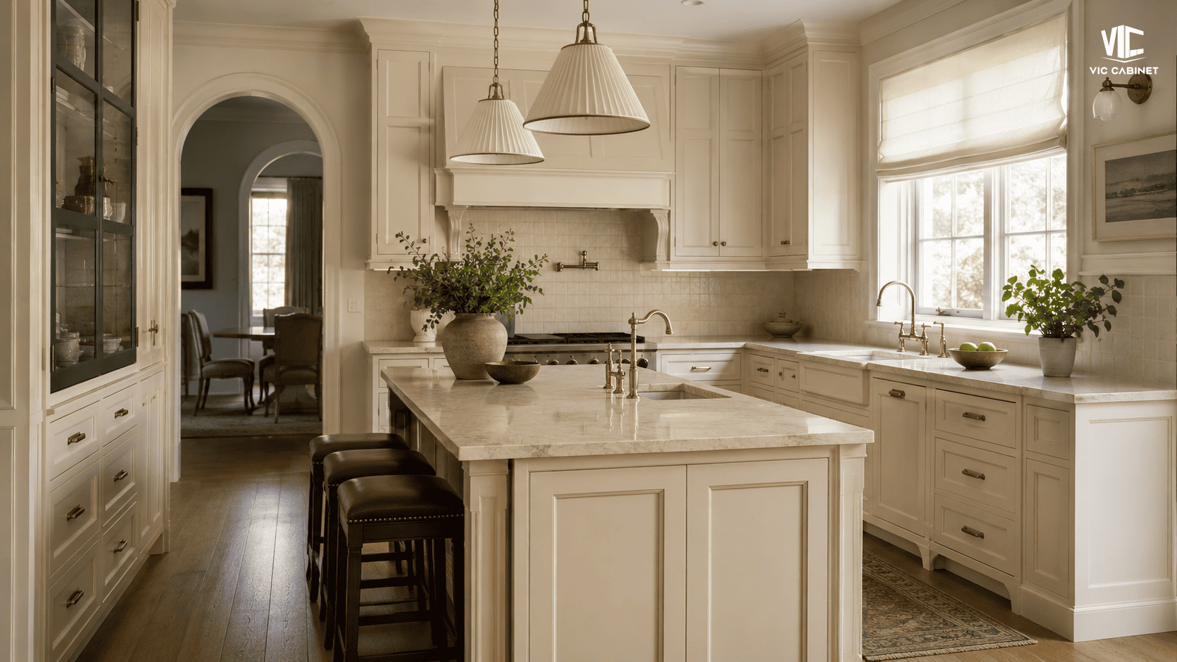 Creamy ivory inset kitchen cabinets paired with beige quartz and warm oak flooring